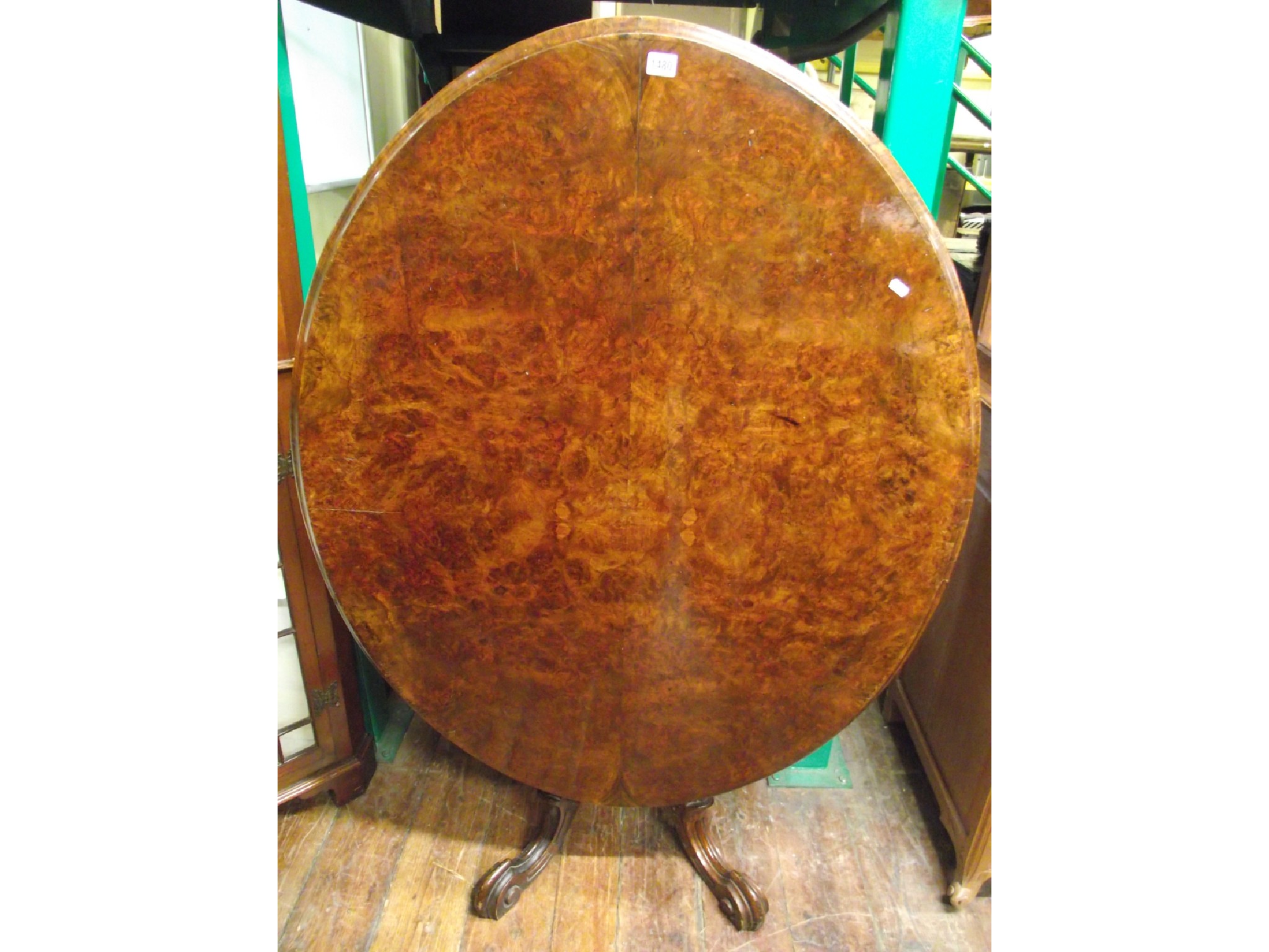 Appraisal: A Victorian walnut and burr walnut loo table the oval