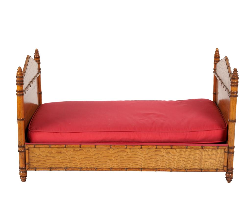 Appraisal: DIMINUTIVE FAUX-BAMBOO BEDwith loose fabric-covered cushion and two bolsters Provenance