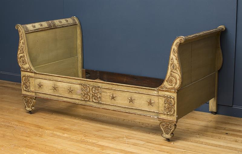 Appraisal: EMPIRE PAINTED AND PARCEL-GILT DAYBED With outscrolled footboard and headboard