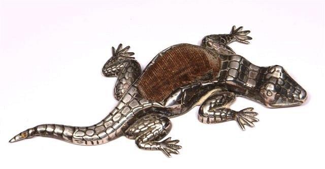 Appraisal: A SILVER PIN CUSHION in the form of a crocodile