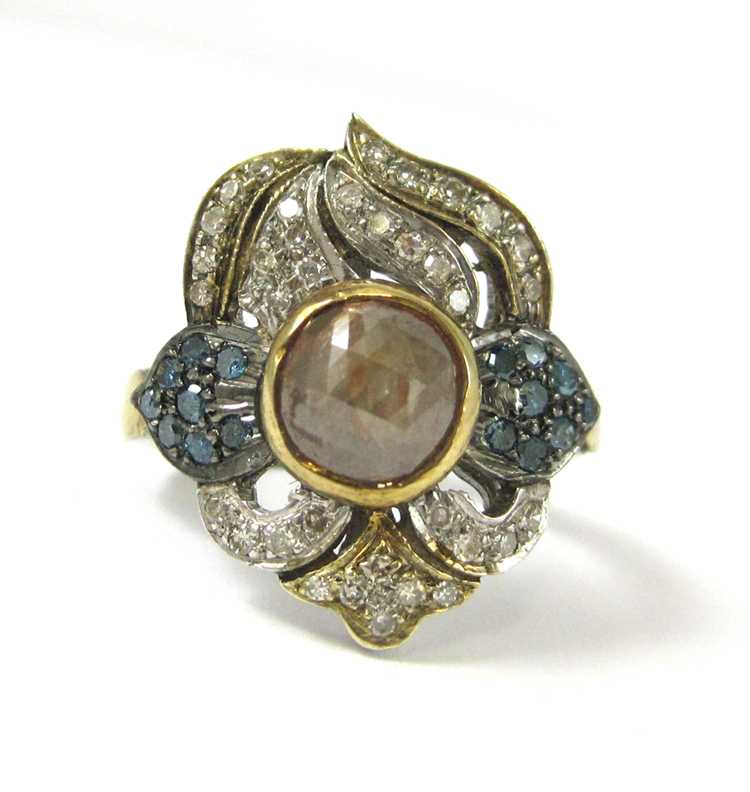 Appraisal: INDIA DIAMOND SILVER AND YELLOW GOLD RING The sterling silver