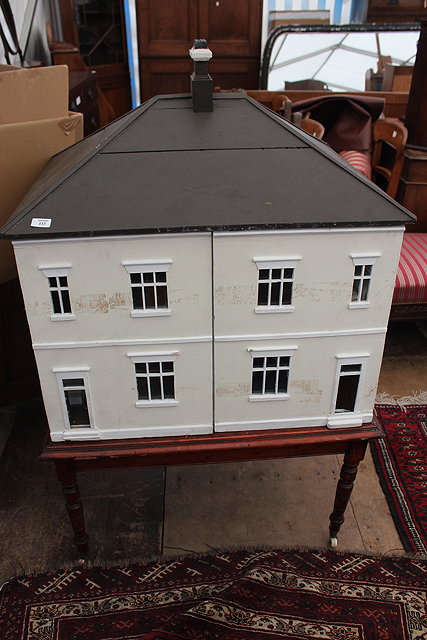 Appraisal: AN ANTIQUE DOUBLE FRONTED DOLLS HOUSE in the form of