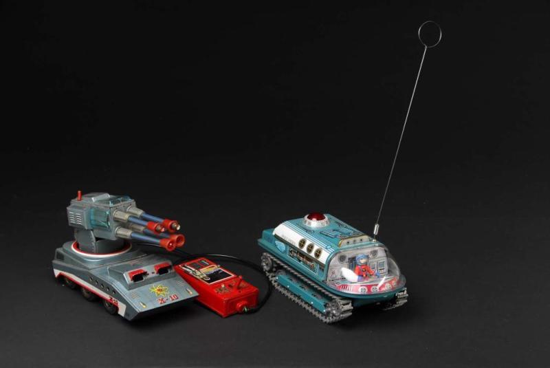 Appraisal: Lot of Tin Space Vehicle Battery-Operated Toys Description Japanese Both