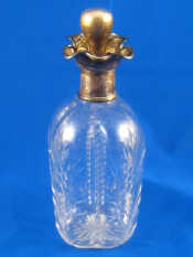 Appraisal: A four lipped silver mounted spirit decanter the lobed body