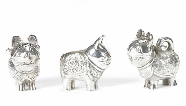 Appraisal: A Japanese silver group of seven similar figural casters Comprising