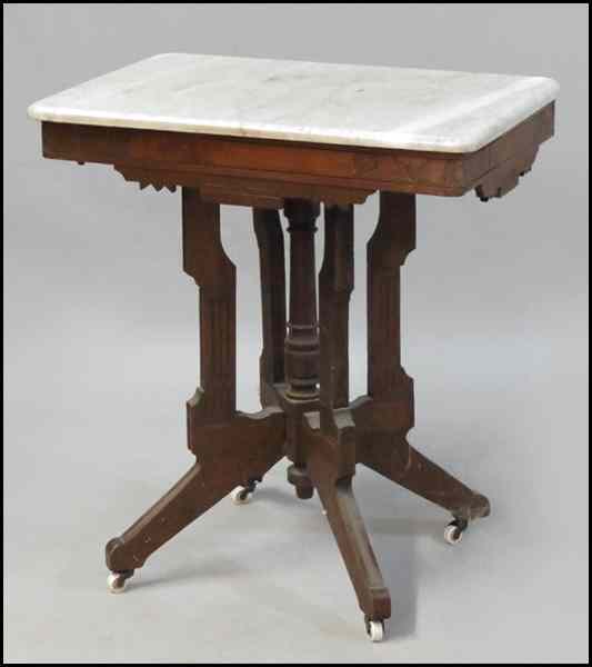 Appraisal: EASTLAKE CARVED WALNUT TABLE With a marble top H ''