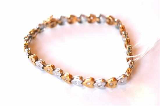 Appraisal: A DIAMOND LINE BRACELET IN TWO TONE GOLD STAMPED CT