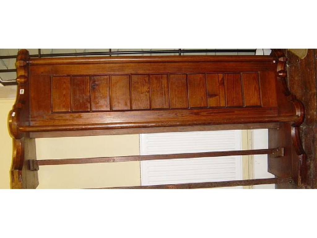 Appraisal: A Victorian pitch pine church pew with shaped ends and