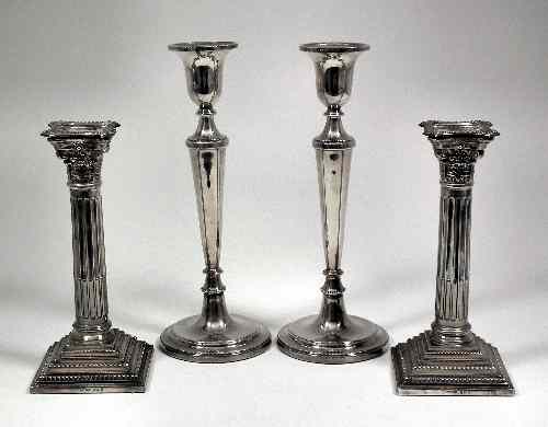 Appraisal: A pair of Elizabeth II silver pillar candlesticks of Corinthian