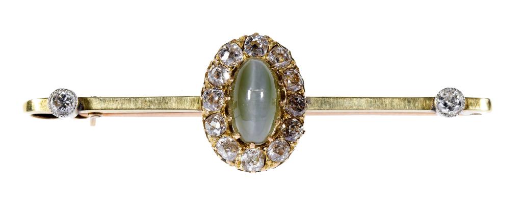 Appraisal: A DIAMOND AND CAT'S EYE CHRYSOBERYL BROOCH the flat bar