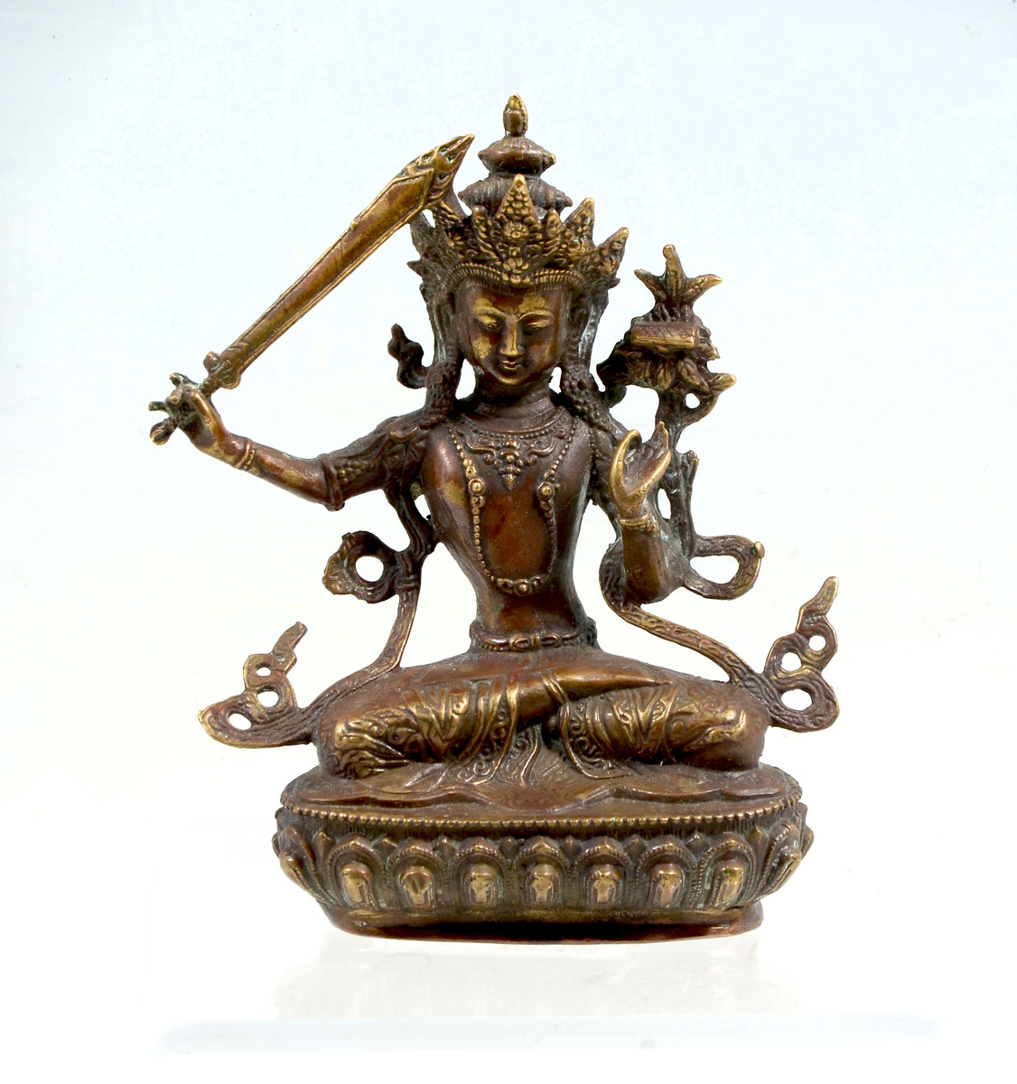 Appraisal: TIBETAN BUDDHIST MANJUSHRI DIETY BRONZE Bronze Tibetan Buddhist deity having