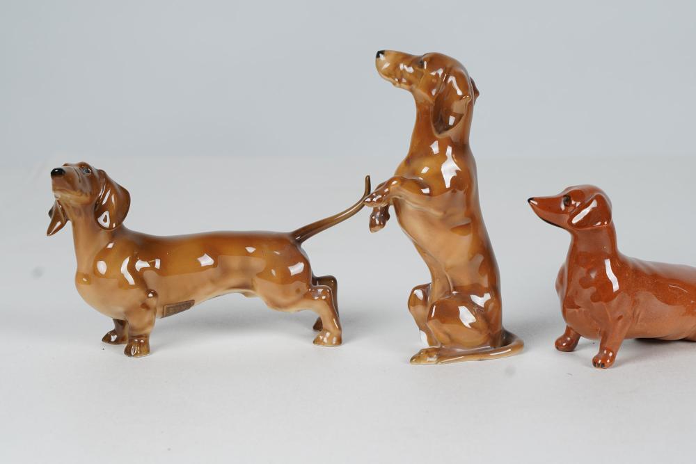 Appraisal: GROUP OF GERMAN ENGLISH PORCELAIN DACHSHUNDScomprising three marked Beswick England