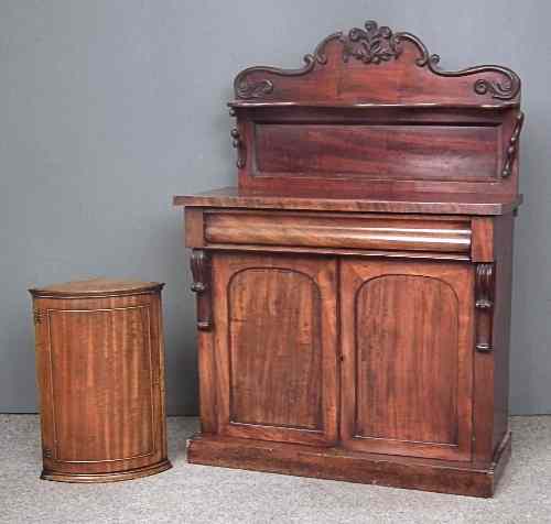 Appraisal: An early Victorian mahogany chiffonier the shaped back fitted single