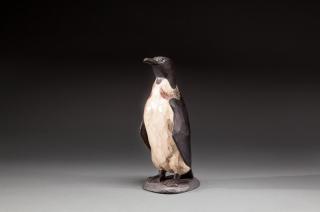 Appraisal: Penguin by by in A chip-carved bird with raised wings