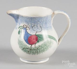 Appraisal: Blue spatter creamer with teal peafowl decoration '' h