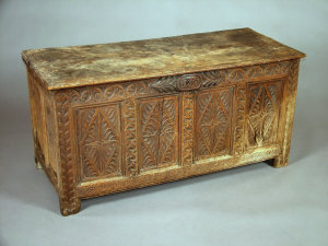 Appraisal: A carved oak four panel coffer early th century with