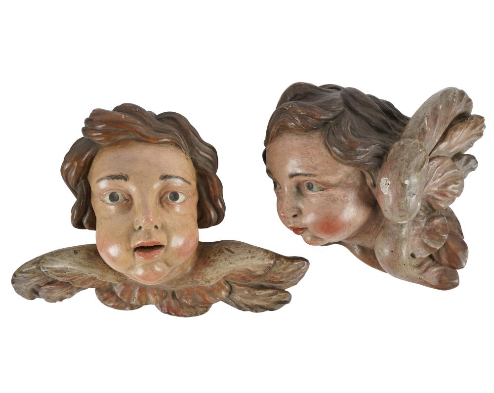 Appraisal: PAIR OF ITALIAN CARVED PAINTED WOOD CHERUB HEADSCondition minor wear