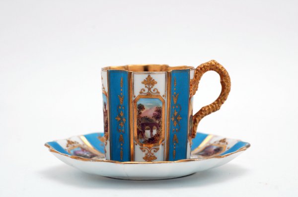 Appraisal: Coalport demitasse cup and saucer handpainted with ten scenic views