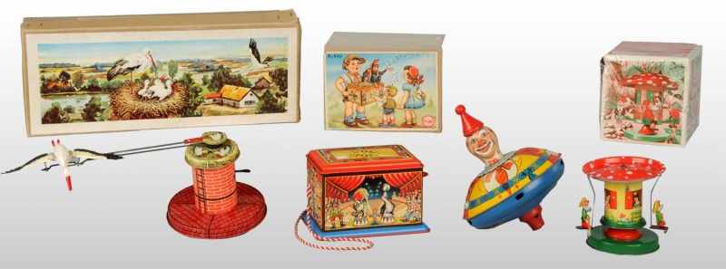 Appraisal: Lot of Tin Lithographed Toys Description German Working Includes one