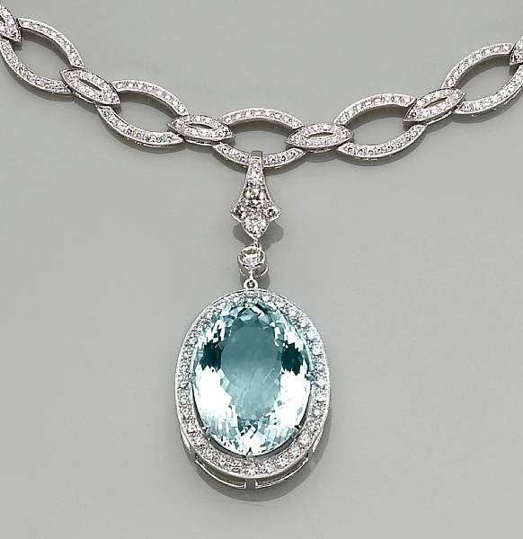 Appraisal: An aquamarine diamond and eighteen karat white gold pendant-enhancer and