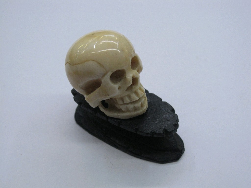 Appraisal: Carved ivory skull on stand