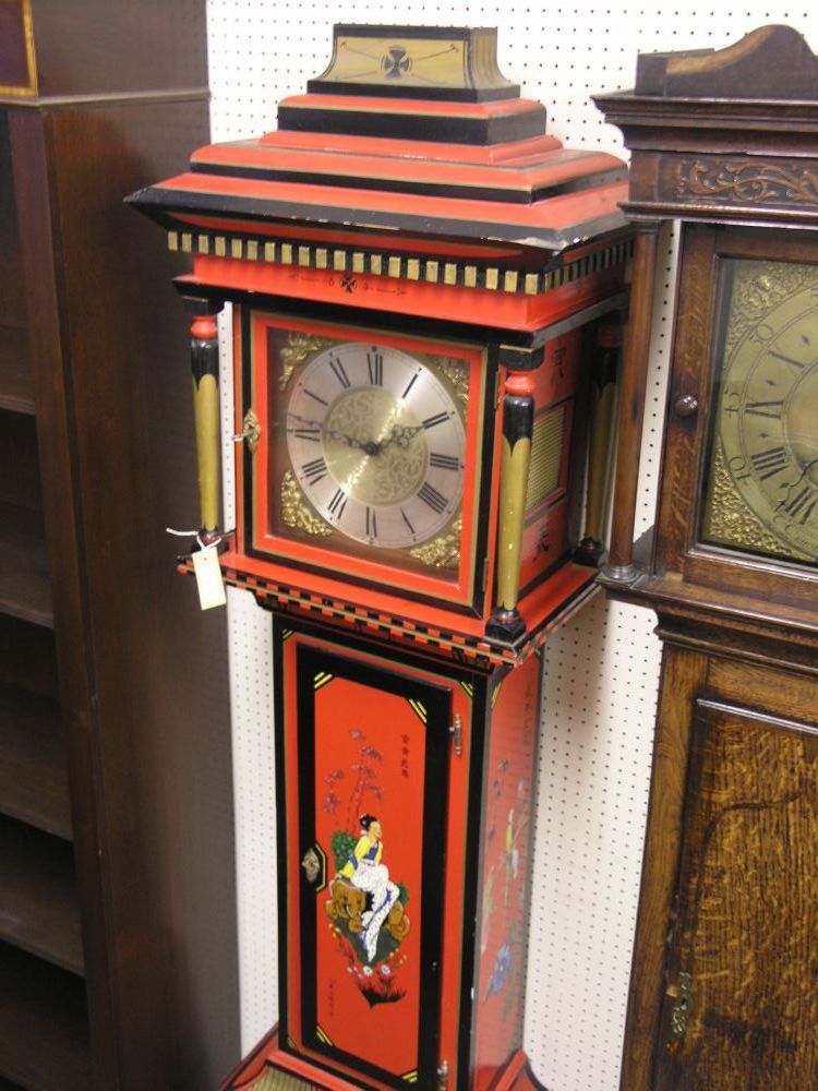 Appraisal: A reproduction red lacquered longcase clock in chinoiserie style traditional