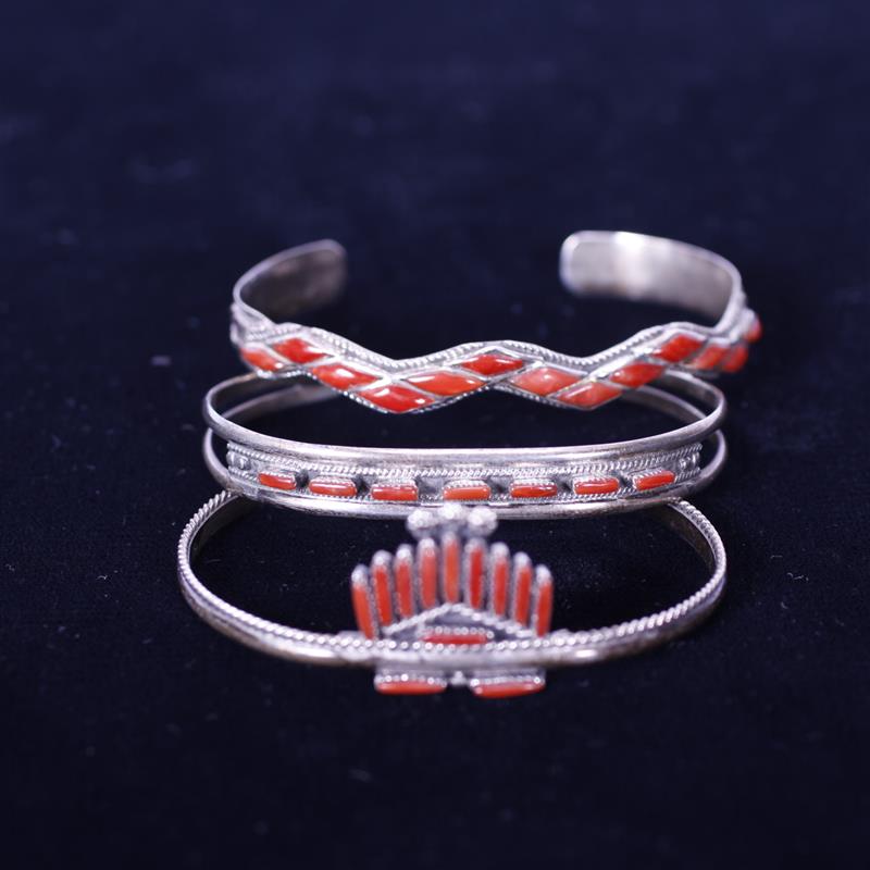 Appraisal: Three Native American Sterling Silver cuff bracelets with coral stones