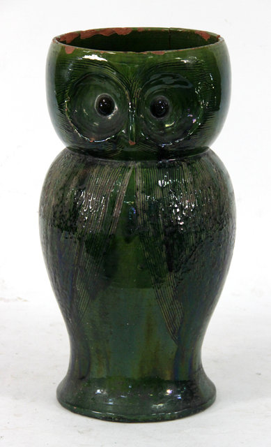 Appraisal: A large Farnham Pottery green glazed owl stick stand cm