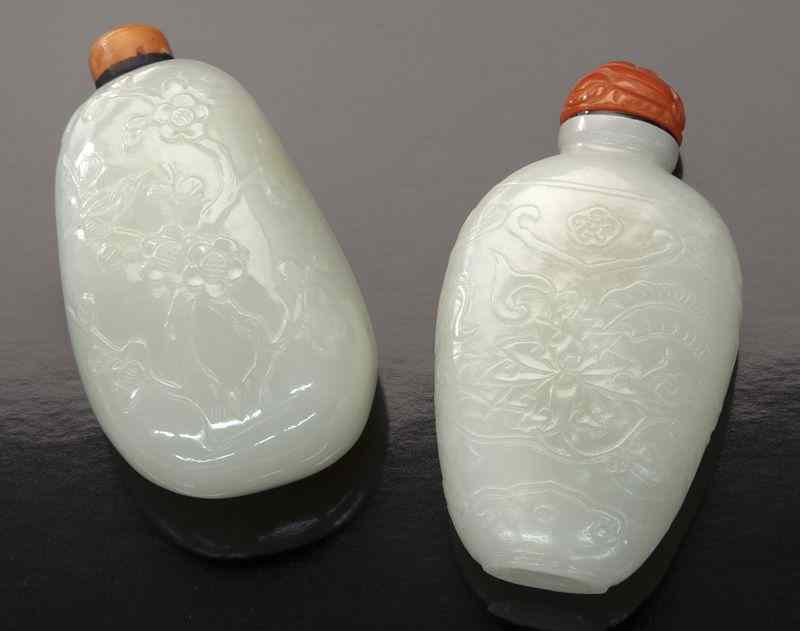 Appraisal: Chinese Qing carved white jade snuff bottlesdepicting birds and flowers