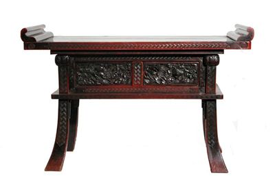 Appraisal: A Japanese red lacquer rectangular table with upturned scroll ends