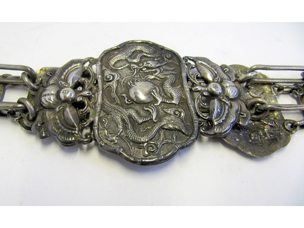 Appraisal: A Chinese white metal belt decorated with figures horsemen and