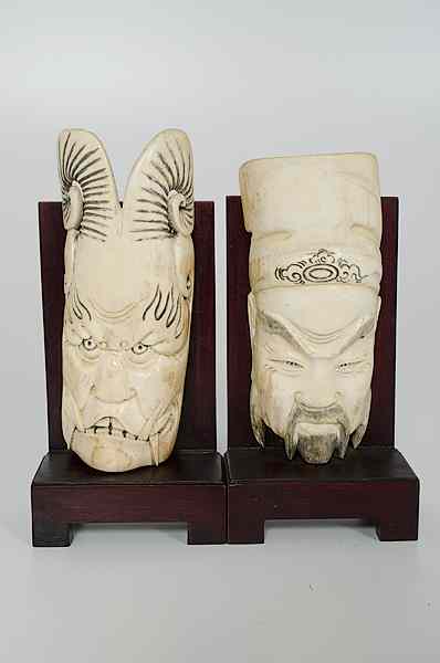 Appraisal: Pair of Chinese Carved Ivory Faces China th century A