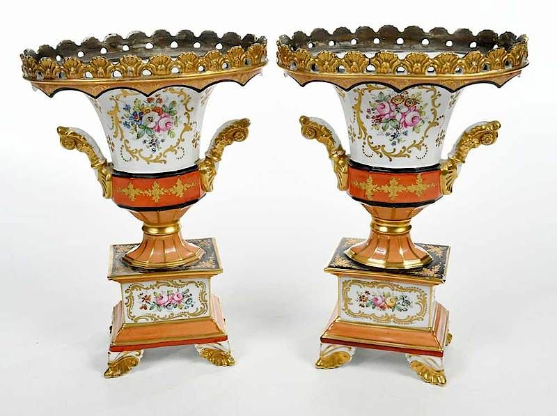 Appraisal: Pair Hand Painted Porcelain Urns Continental th century gilt decorated