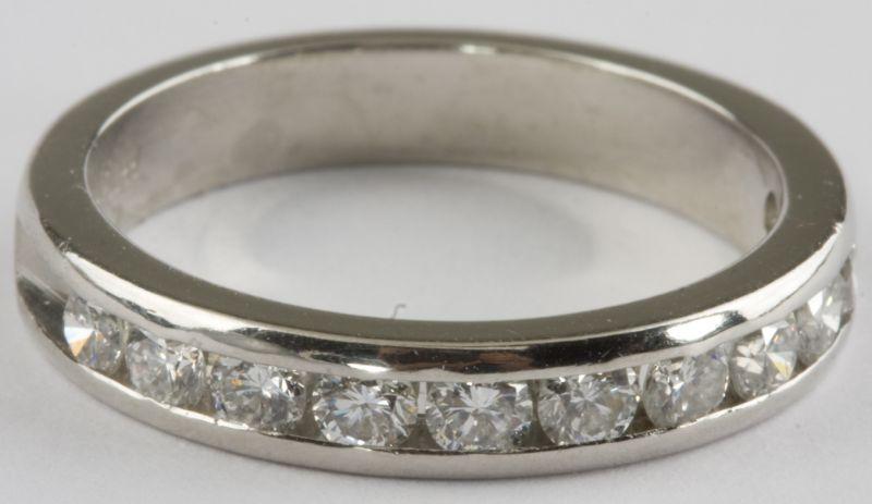 Appraisal: KT White Gold Diamond Wedding Band with channel set round