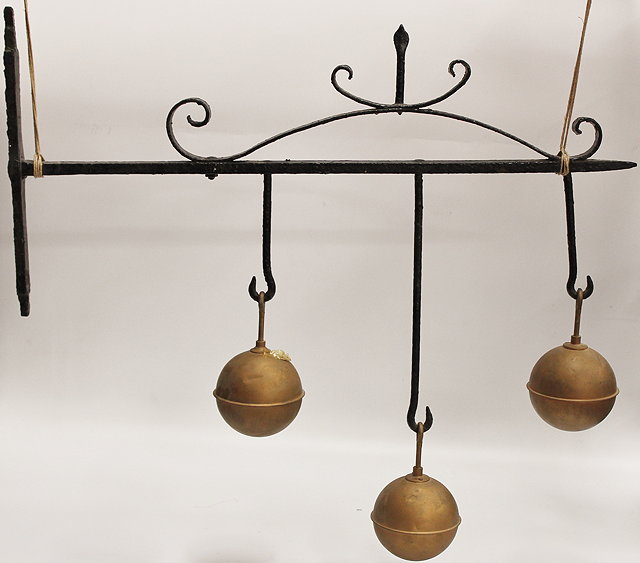 Appraisal: A WROUGHT IRON PAWN BROKERS SIGN with gilded spheres and