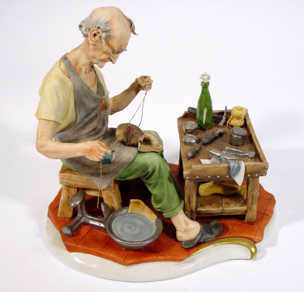 Appraisal: Hand painted Capo-di-Monte figure a cobbler at his table artists