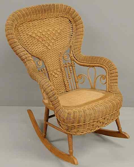 Appraisal: Wicker rocker with ball stick decoration h x w x