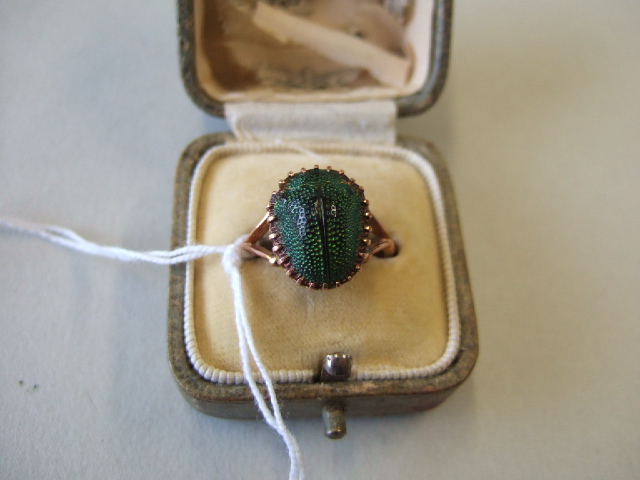 Appraisal: A gold ring mounted with a scarab beetle detailed ct