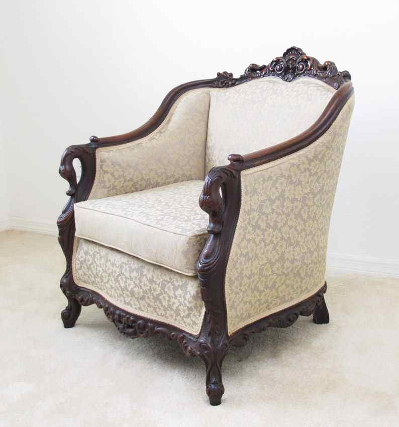 Appraisal: CARVED SWAN NECK LIBRARY CHAIR Carved crest with shaped arms