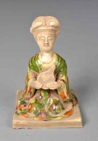 Appraisal: A Chinese Tang Dynasty Pottery FigureMolded to depict a kneeling