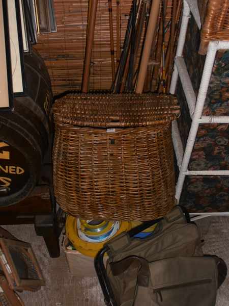 Appraisal: A LARGE COLLECTION OF FISHING GEAR INCLUDING NETS FISHING RODS