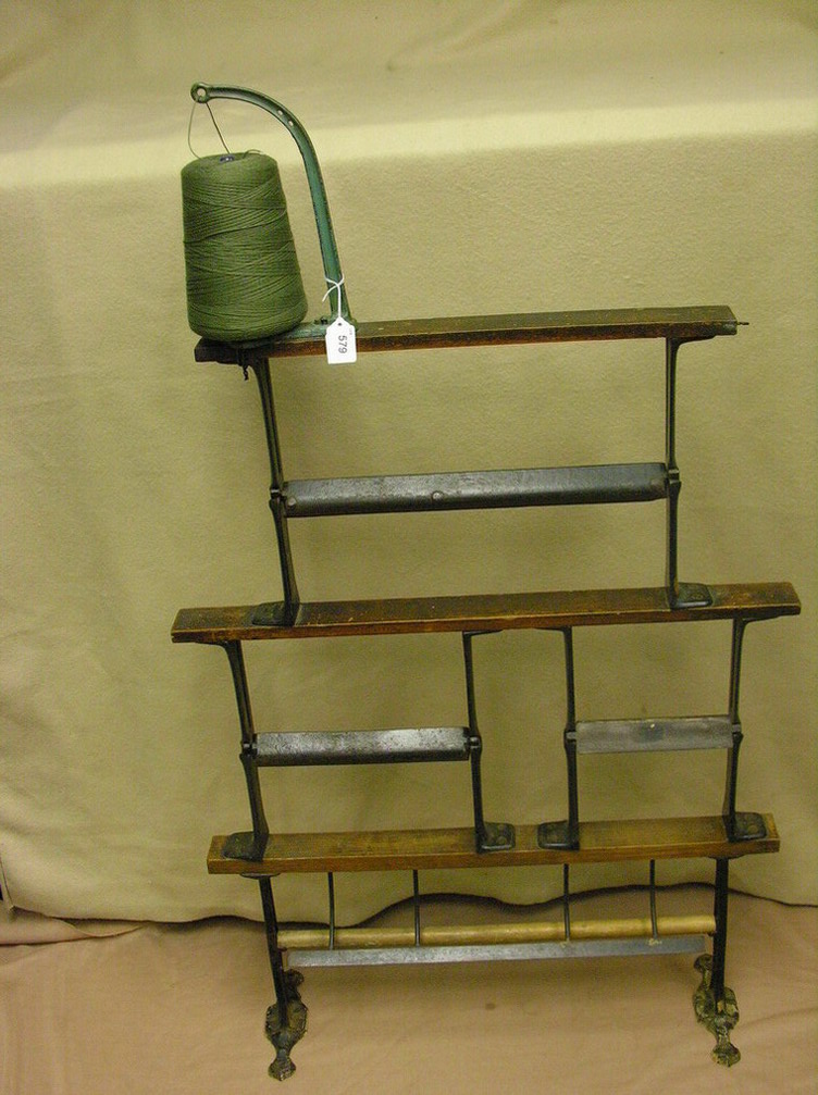 Appraisal: COUNTRY STORE TRIPLE PAPER CUTTER Cast iron and wood string