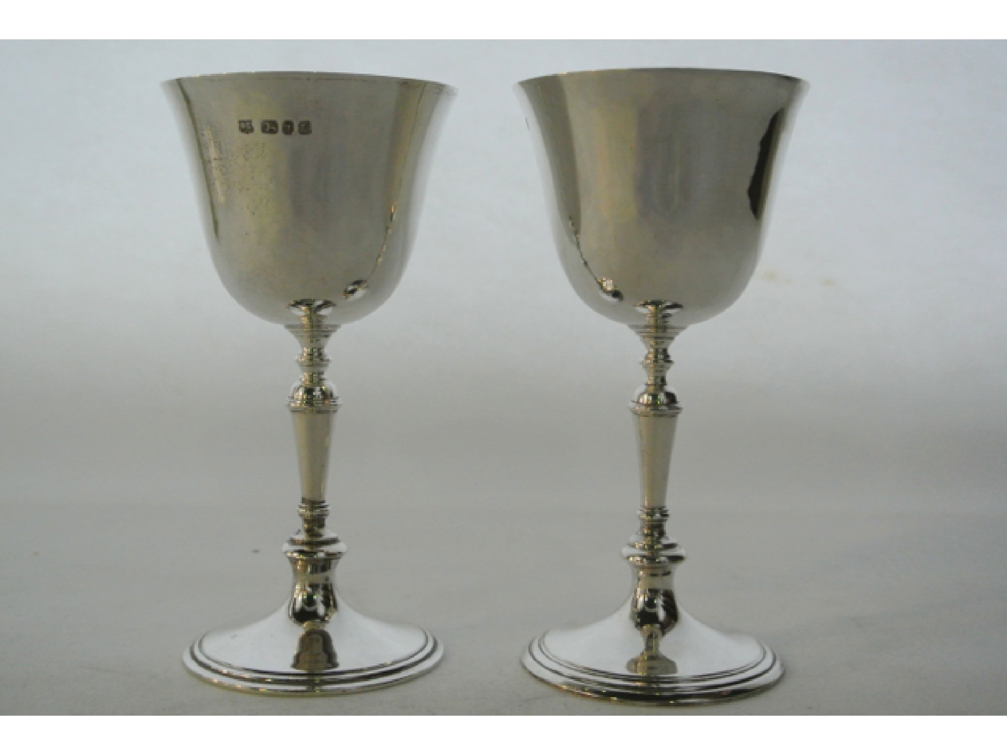 Appraisal: A pair of silver goblets William Comyns Sons Ltd London