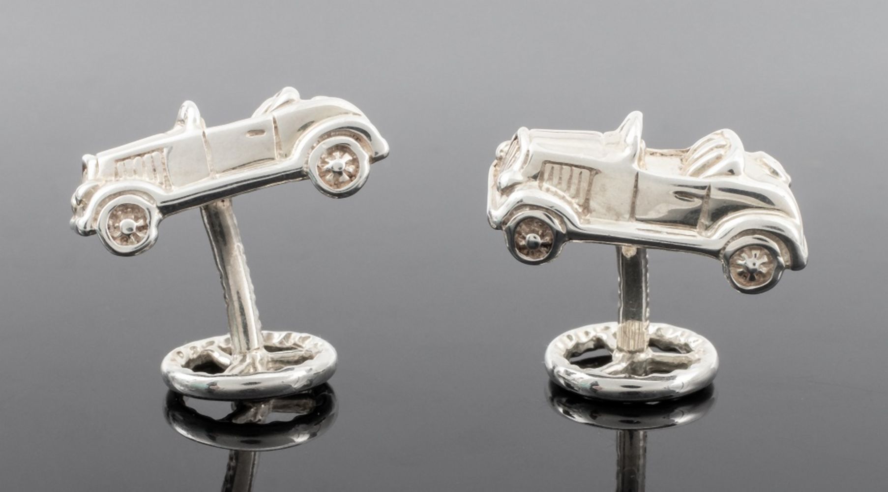 Appraisal: TIFFANY CO CAR STEERING WHEEL CUFFLINKS Pair of Tiffany Co