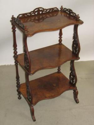 Appraisal: A VICTORIAN WALNUT WHATNOT of three tier oblong form the