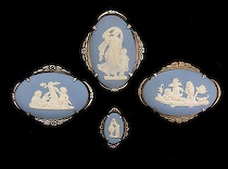 Appraisal: Four Wedgwood Light Blue Jasper Brooches In Matching Silver Frames