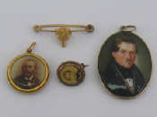 Appraisal: Three miniatures an oval oil miniature of a gentleman in