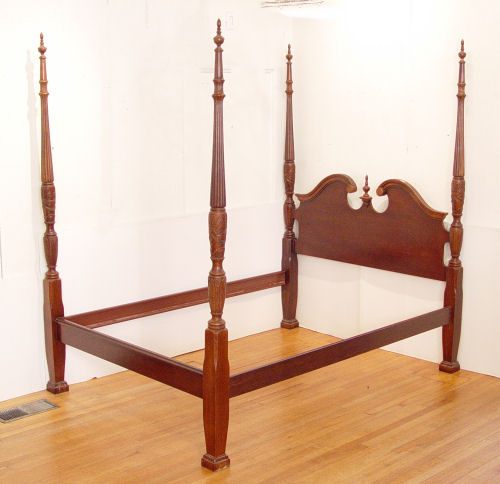 Appraisal: MAHOGANY POSTER BED Broken pediment headboard straight footboard carved posts