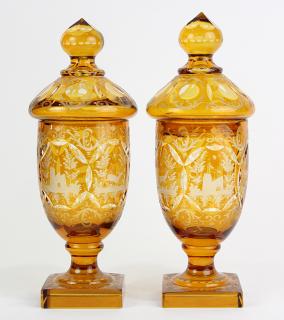 Appraisal: Pair of Bohemian cut to clear covered urns executed in