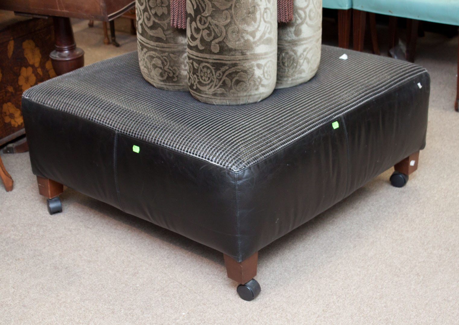 Appraisal: Contemporary black naugahyde upholstered ottoman in H in Sq Condition